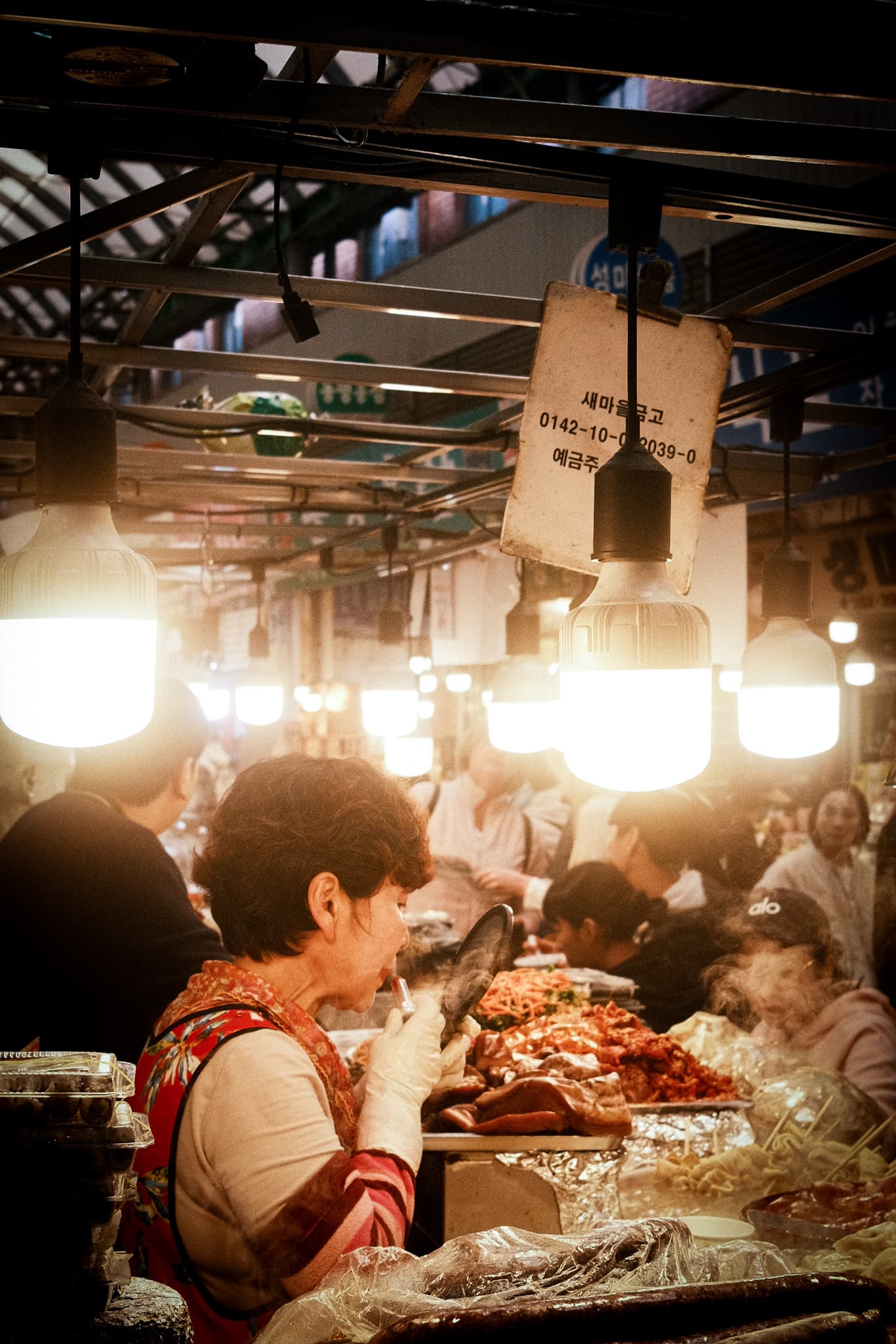 A market stall holder freshening up before their next customer